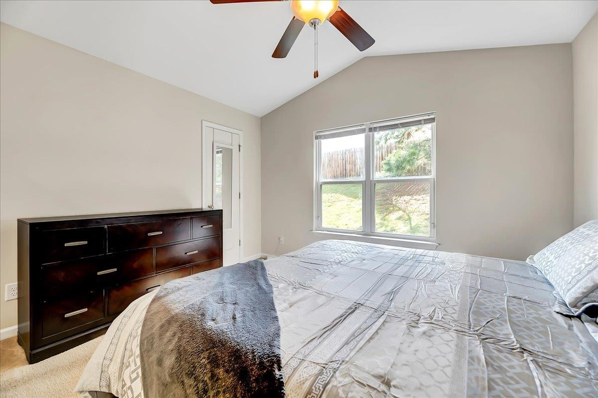 1621 Brownairs Lane Raleigh, NC 27610 - Photo 15 of 29 a bedroom with a bed and a dresser