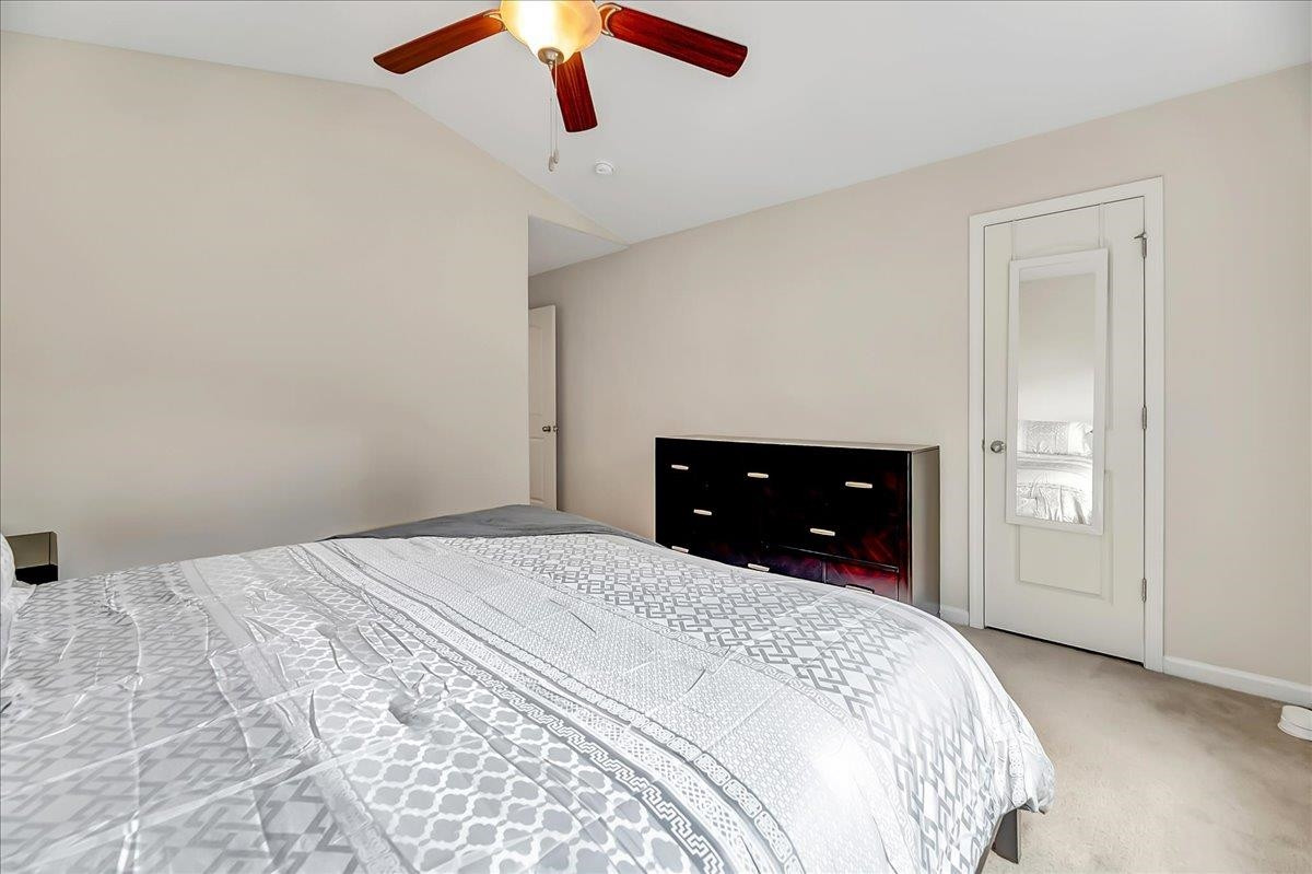 1621 Brownairs Lane Raleigh, NC 27610 - Photo 17 of 29 a bedroom with a bed and a ceiling fan