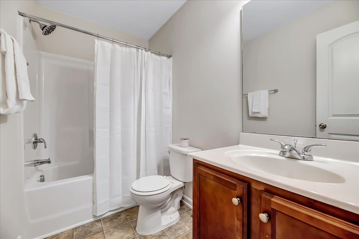 1621 Brownairs Lane Raleigh, NC 27610 - Photo 18 of 29 a bathroom with a sink a toilet and shower