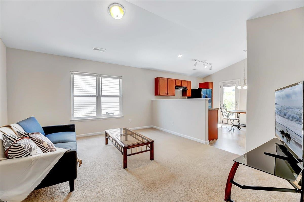 1621 Brownairs Lane Raleigh, NC 27610 - Photo 4 of 29 a living room with furniture and a flat screen tv