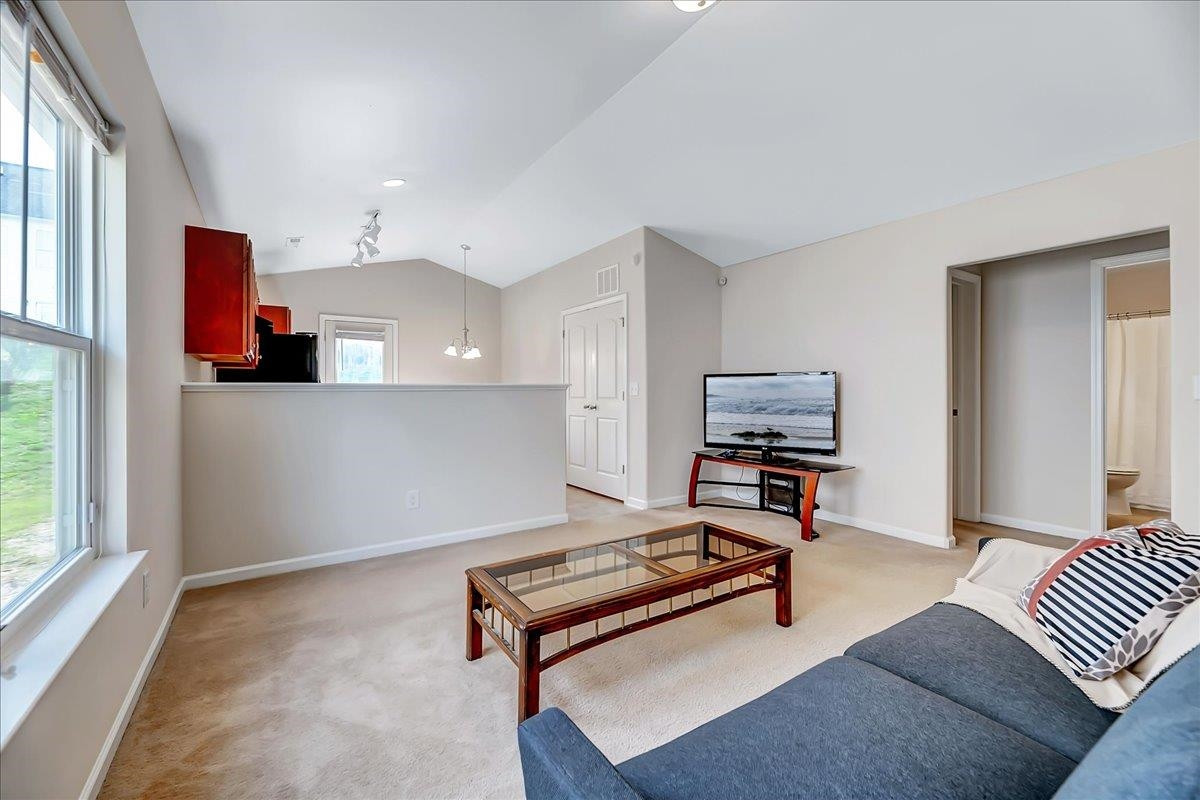 1621 Brownairs Lane Raleigh, NC 27610 - Photo 7 of 29 a living room with furniture and a window