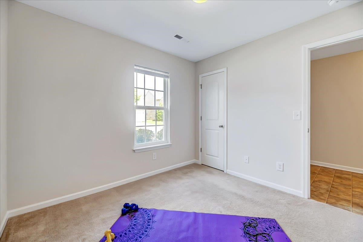 1621 Brownairs Lane Raleigh, NC 27610 - Photo 9 of 29 a view of room with hardwood floor and window