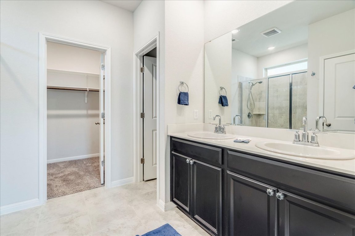 101 Otella Street Georgetown, TX 78628 - Photo 16 of 33 a bathroom with a double vanity sink mirror and double