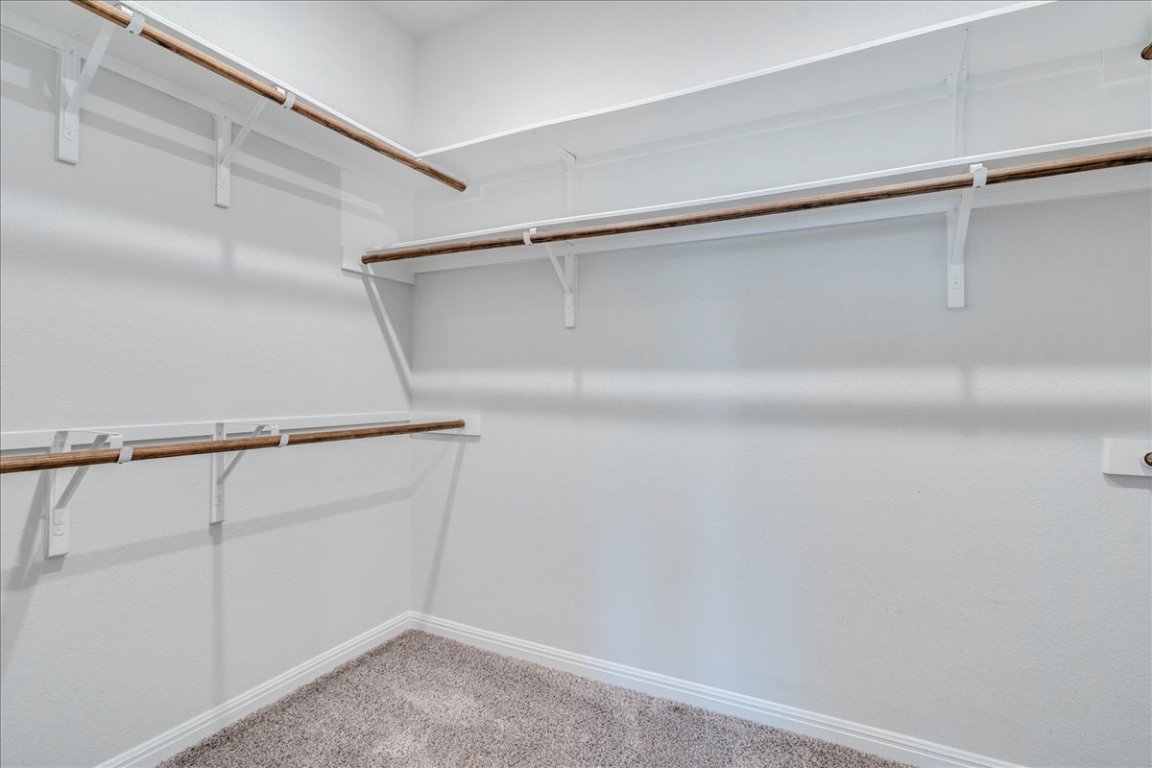101 Otella Street Georgetown, TX 78628 - Photo 18 of 33 a view of an empty walk in closet