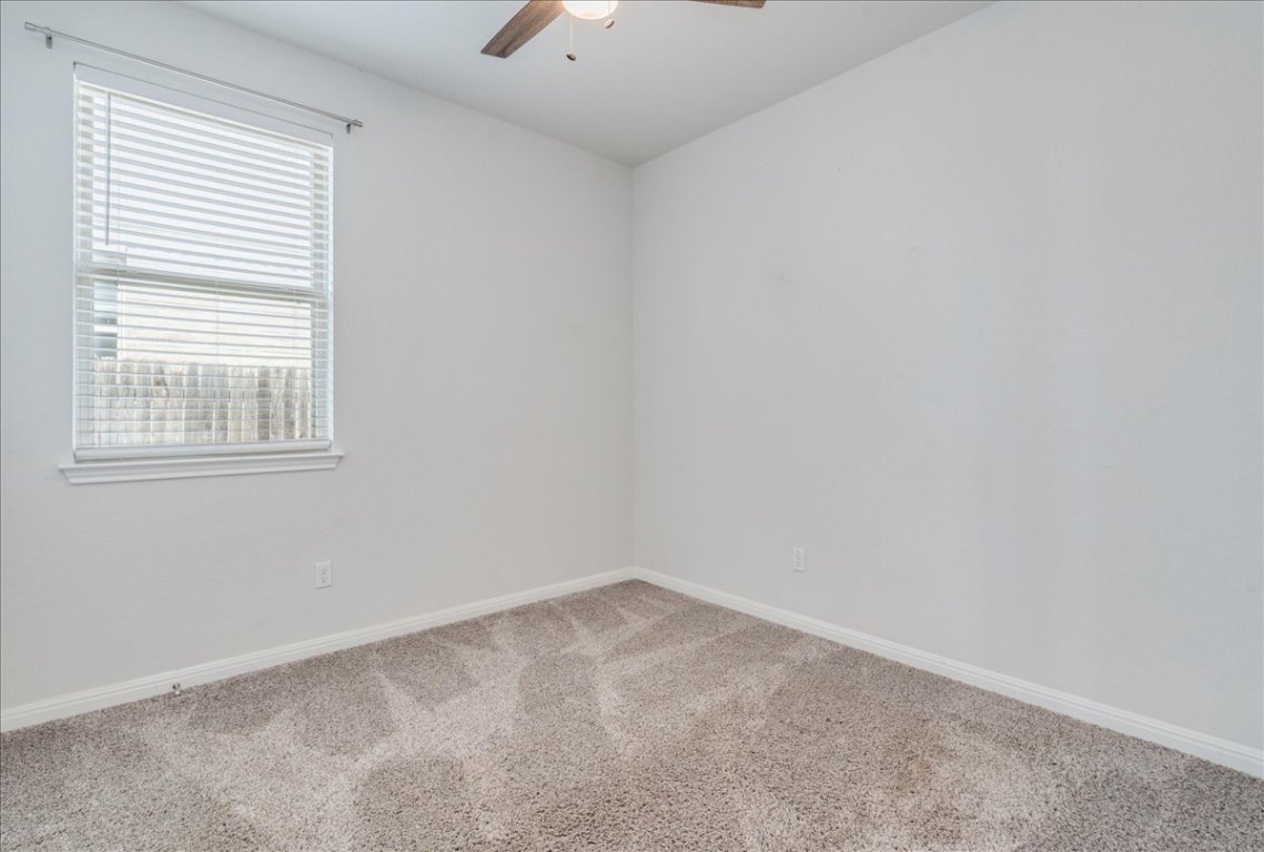 101 Otella Street Georgetown, TX 78628 - Photo 22 of 33 an empty room with a window