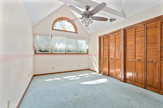 a bathroom with a granite countertop sink a mirror and a shower