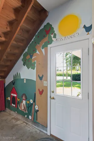 a view of an entryway with a ceiling fan