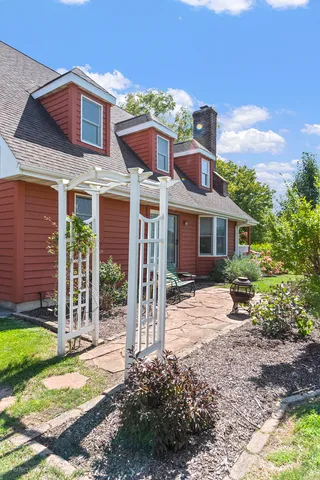a view of a house with a yard and plants