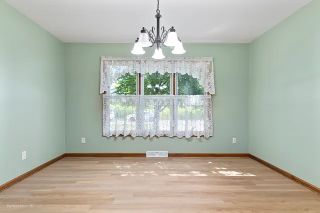 a large kitchen with a sink and dishwasher