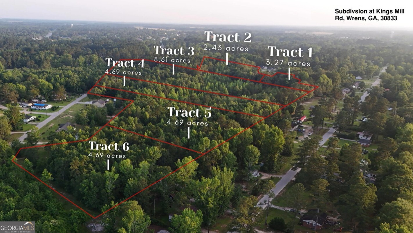 0 Kings Mill Road, Unit 6 Wrens, GA 30833 - Photo 20 of 23 a view of a city with lush green forest