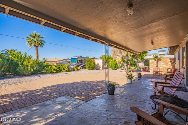 a view of a patio with wooden floor
