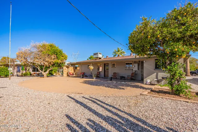 a view of a house with a snow on the road