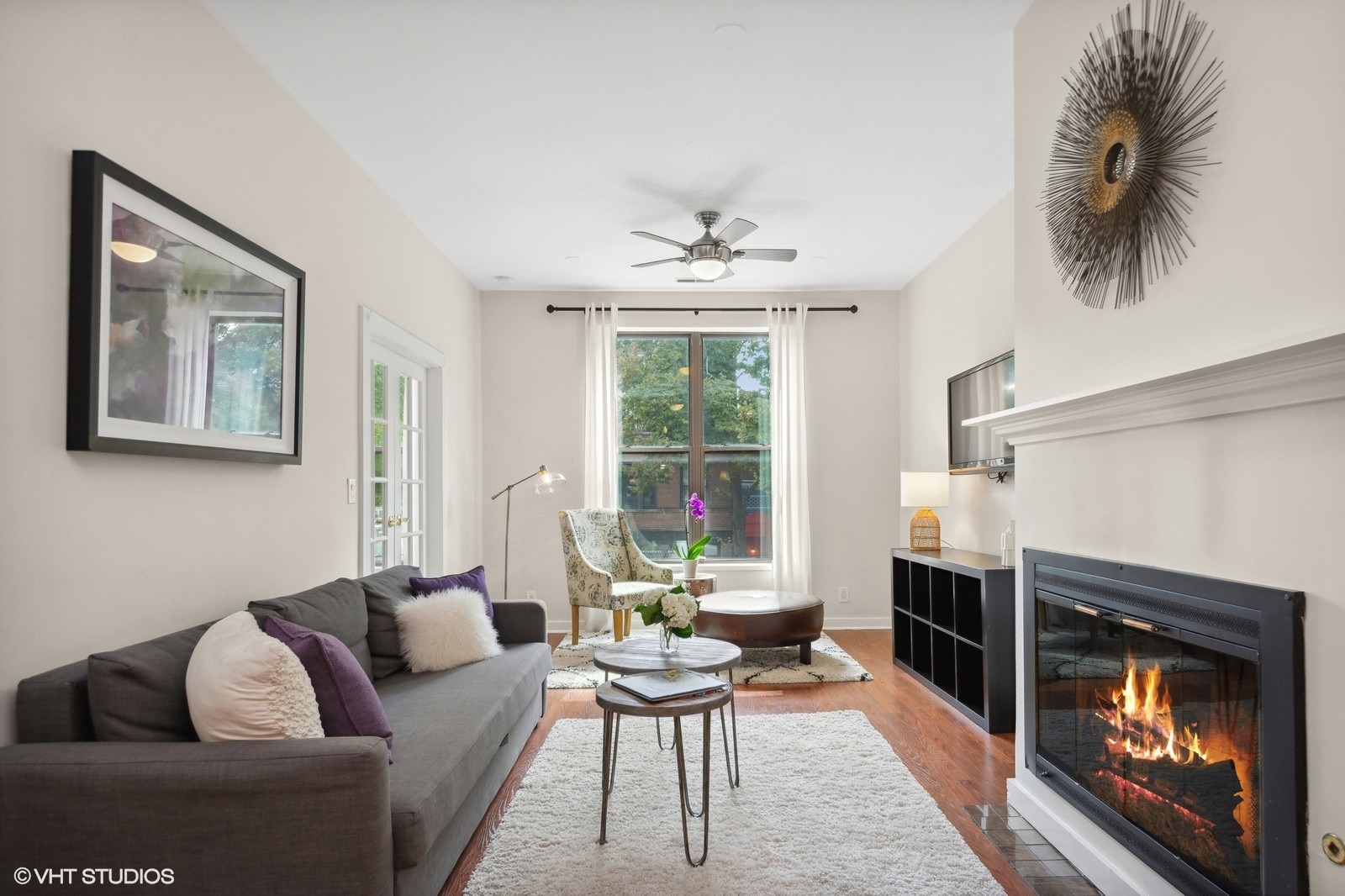 2008 West Roscoe Street, Unit 2 Chicago, IL 60618 - Photo 2 of 13 a living room with furniture and a fireplace