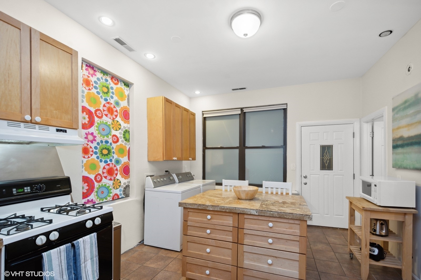 2008 West Roscoe Street, Unit 2 Chicago, IL 60618 - Photo 5 of 13 a bathroom with a sink a vanity and a mirror