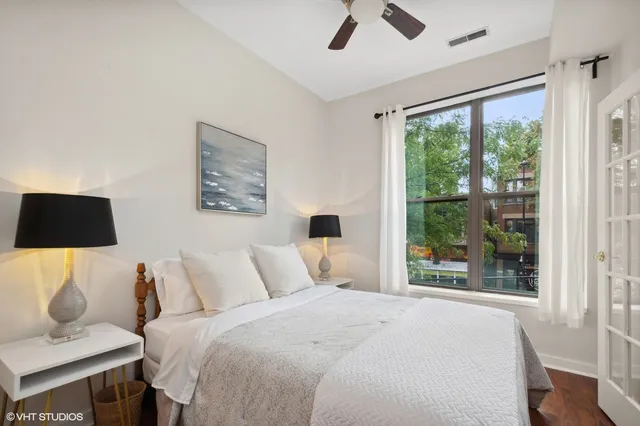 a bedroom with a bed and a window