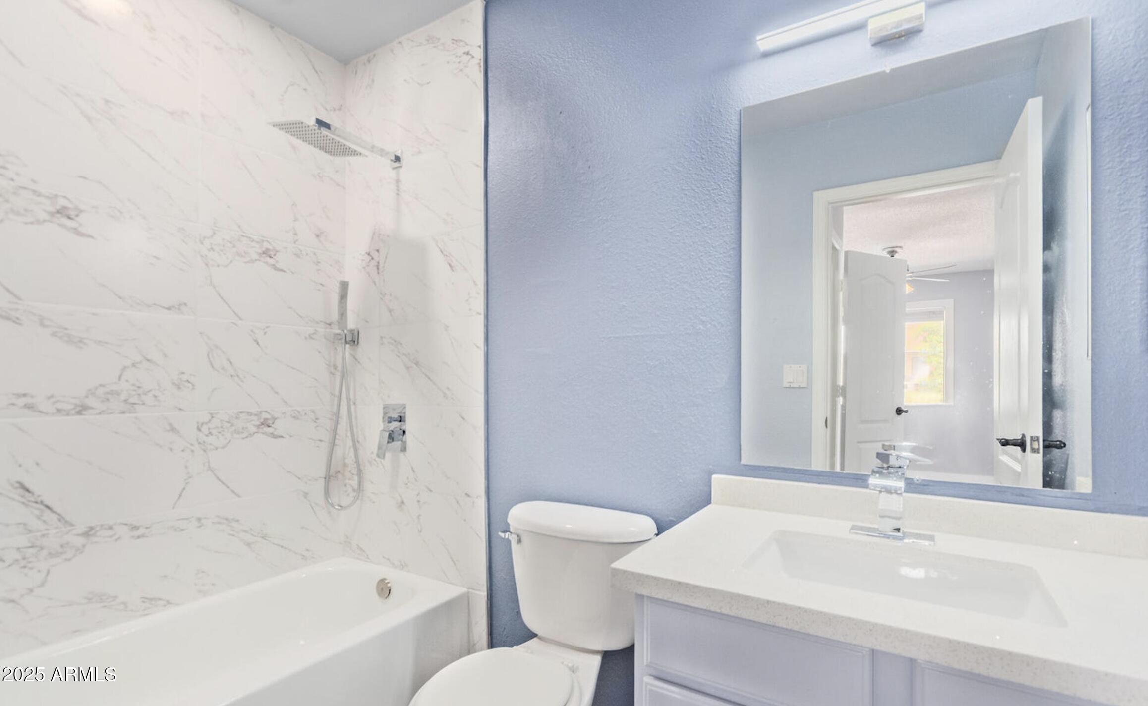 3511 East Baseline Road, Unit 1216 Phoenix, AZ 85042 - Photo 3 of 11 a bathroom with a sink a toilet and shower