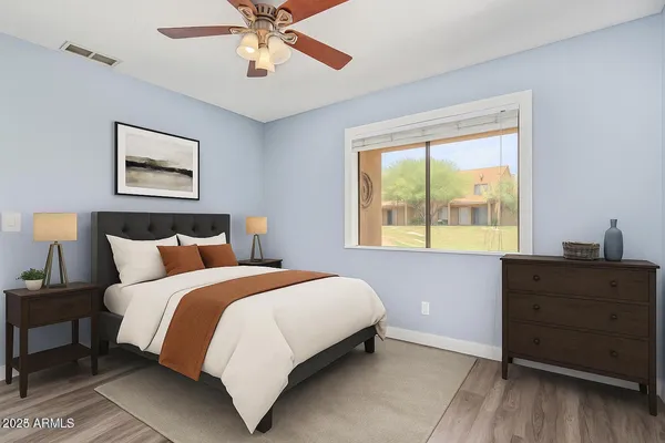 a bedroom with a bed and a window