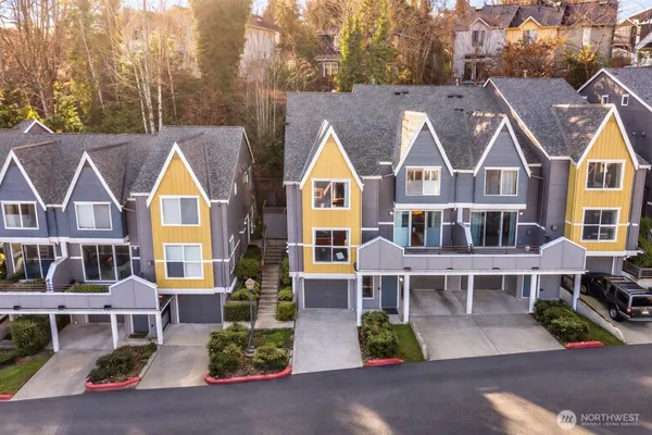 an aerial view of a house with a yard and potted plants