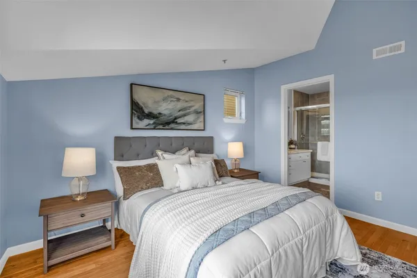 a bedroom with bed and window