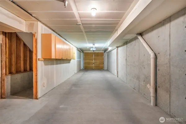 a view of a hallway with washer and dryer