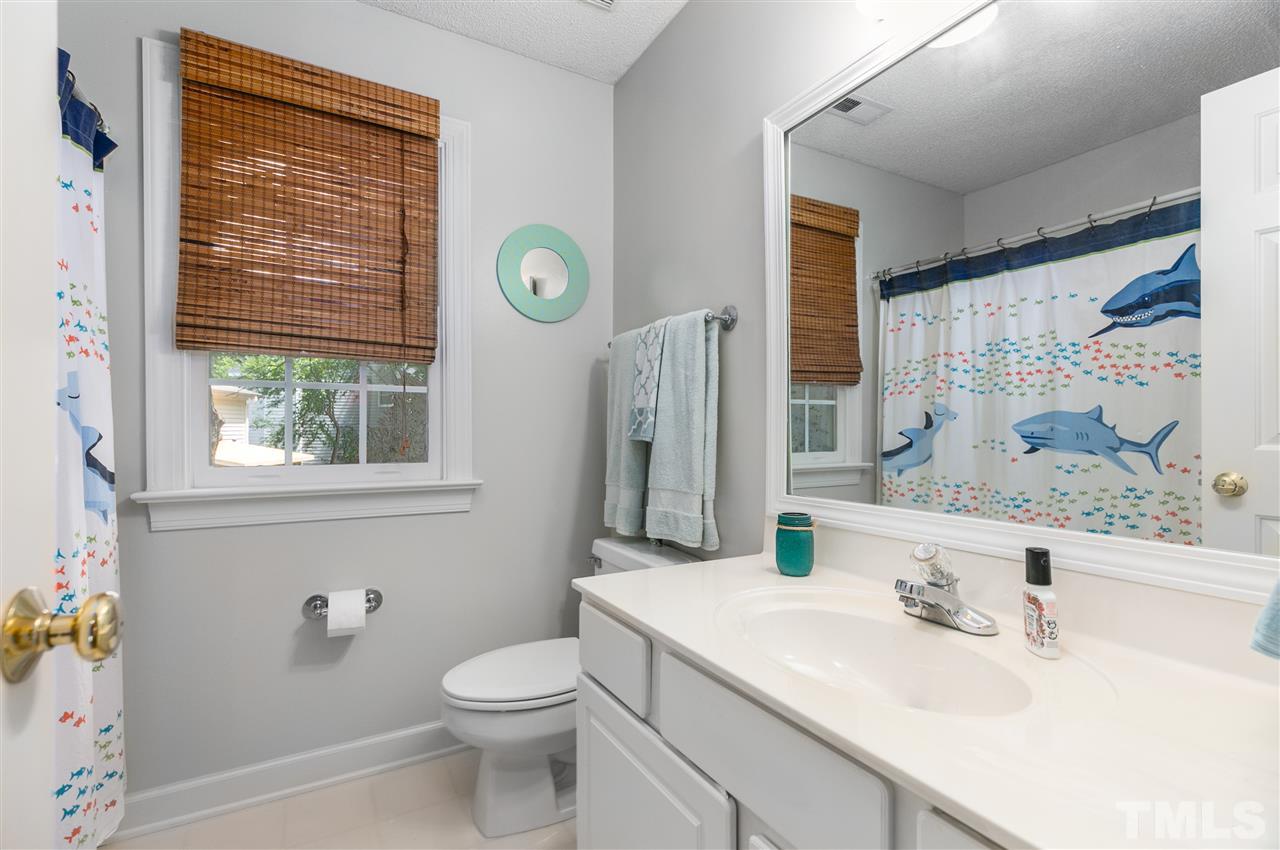 5105 Knightsbridge Way Raleigh, NC 27604 - Photo 14 of 25 a bathroom with a sink toilet and shower
