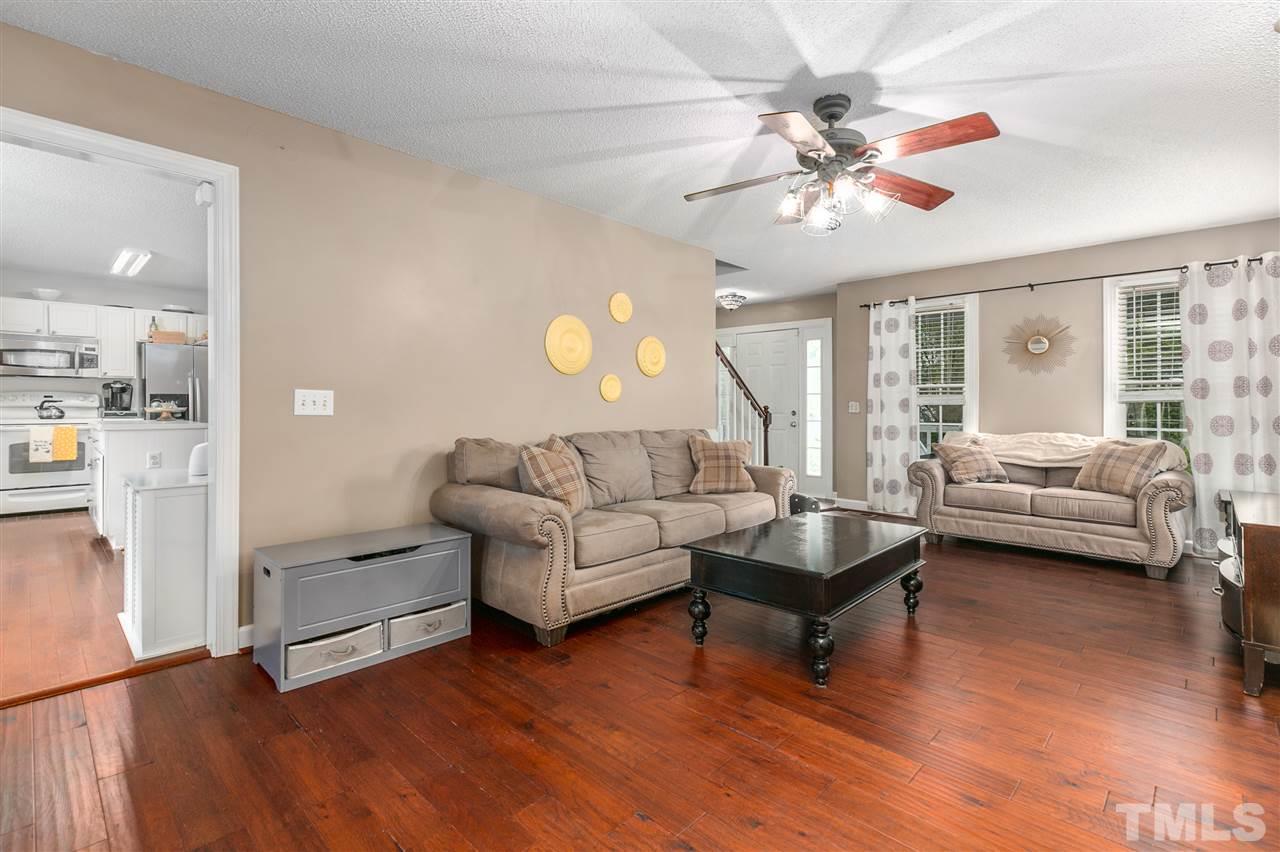 5105 Knightsbridge Way Raleigh, NC 27604 - Photo 5 of 25 a living room with furniture and a large window