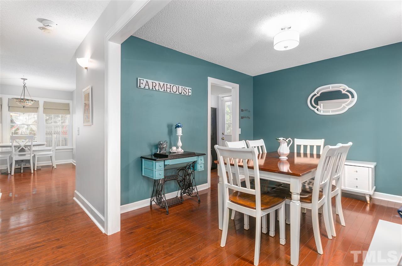 5105 Knightsbridge Way Raleigh, NC 27604 - Photo 7 of 25 a view of a dining room with furniture and wooden floor