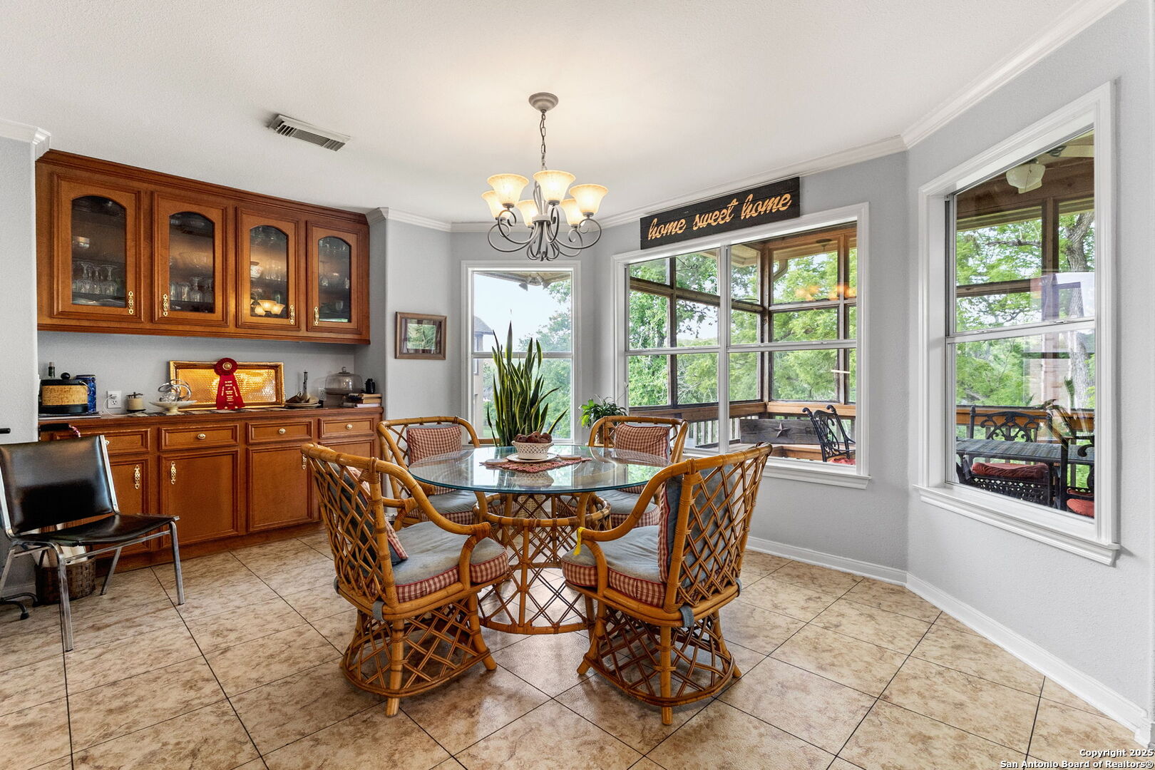 1434 Whispering Water Spring Branch, TX 78070 - Photo 11 of 45 a dining room with furniture a chandelier and wooden floor