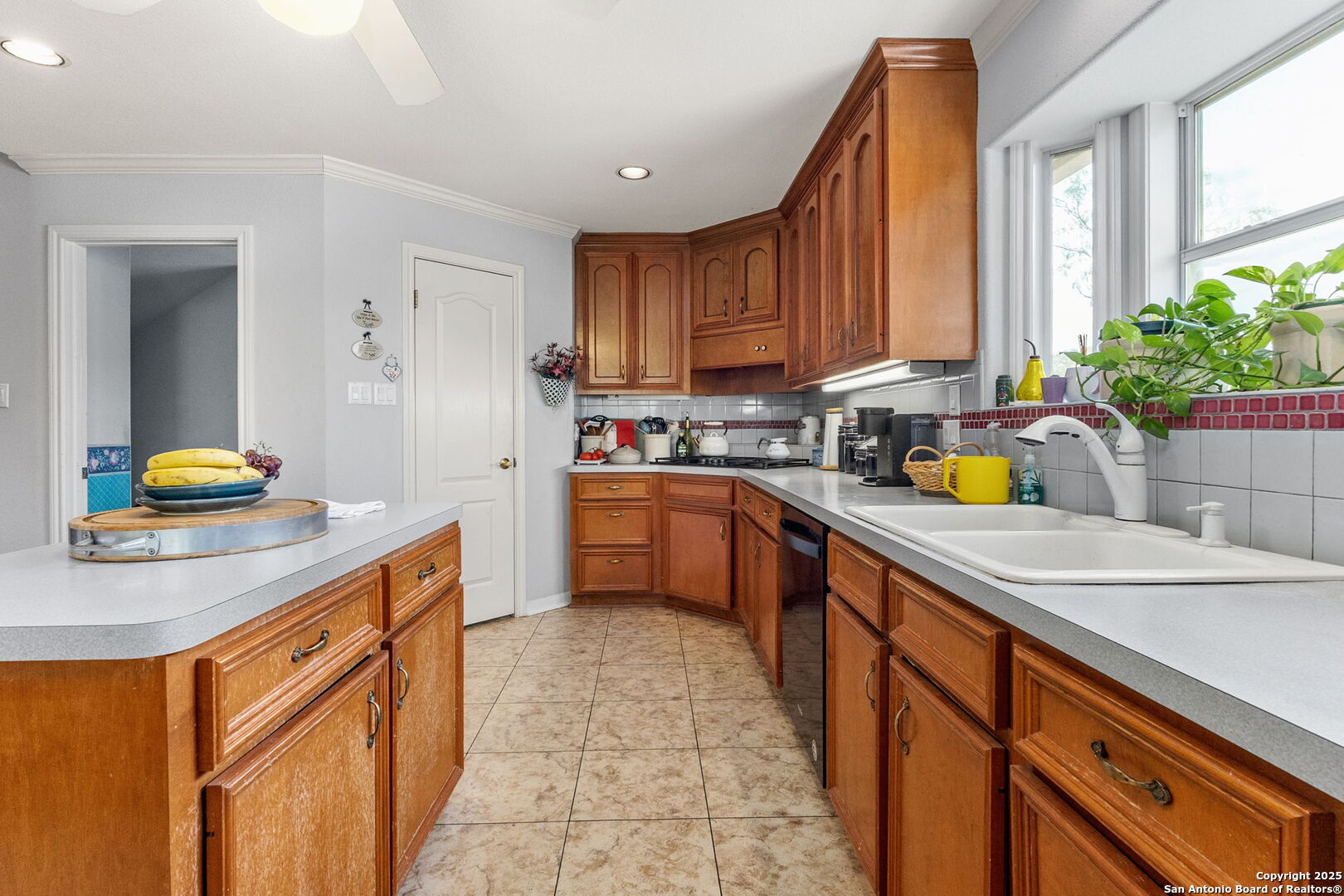 1434 Whispering Water Spring Branch, TX 78070 - Photo 12 of 45 a kitchen with a sink stove and cabinets