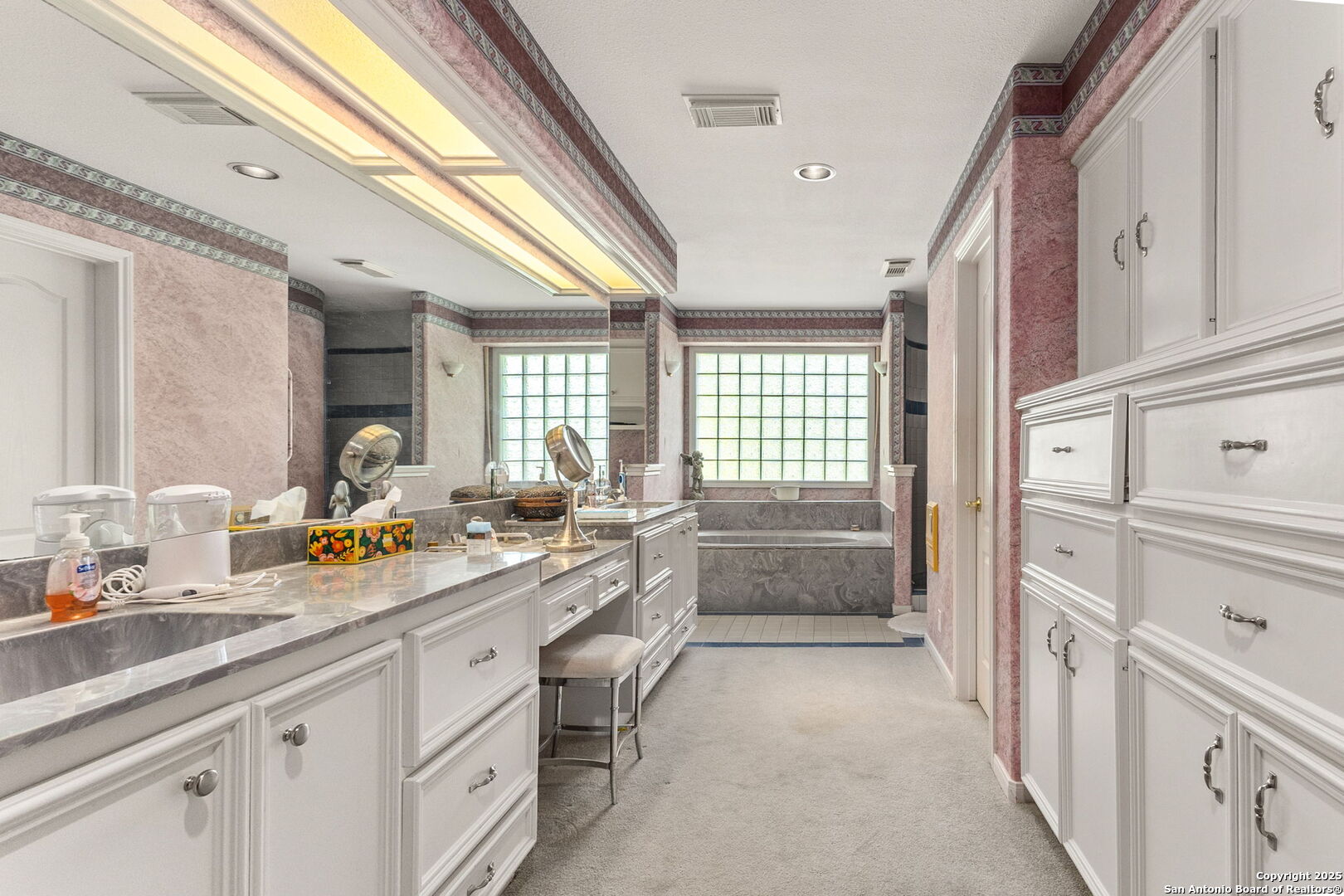 1434 Whispering Water Spring Branch, TX 78070 - Photo 18 of 45 a spacious bathroom with a granite countertop sink mirror and a bath tub