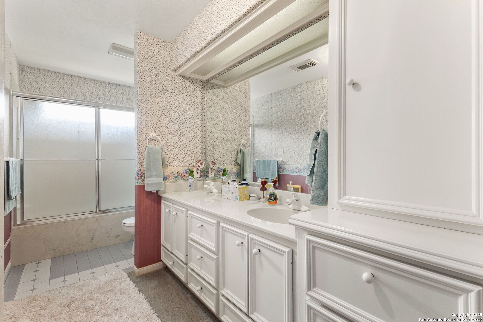 1434 Whispering Water Spring Branch, TX 78070 - Photo 22 of 45 a bathroom with a sink a mirror and a shower