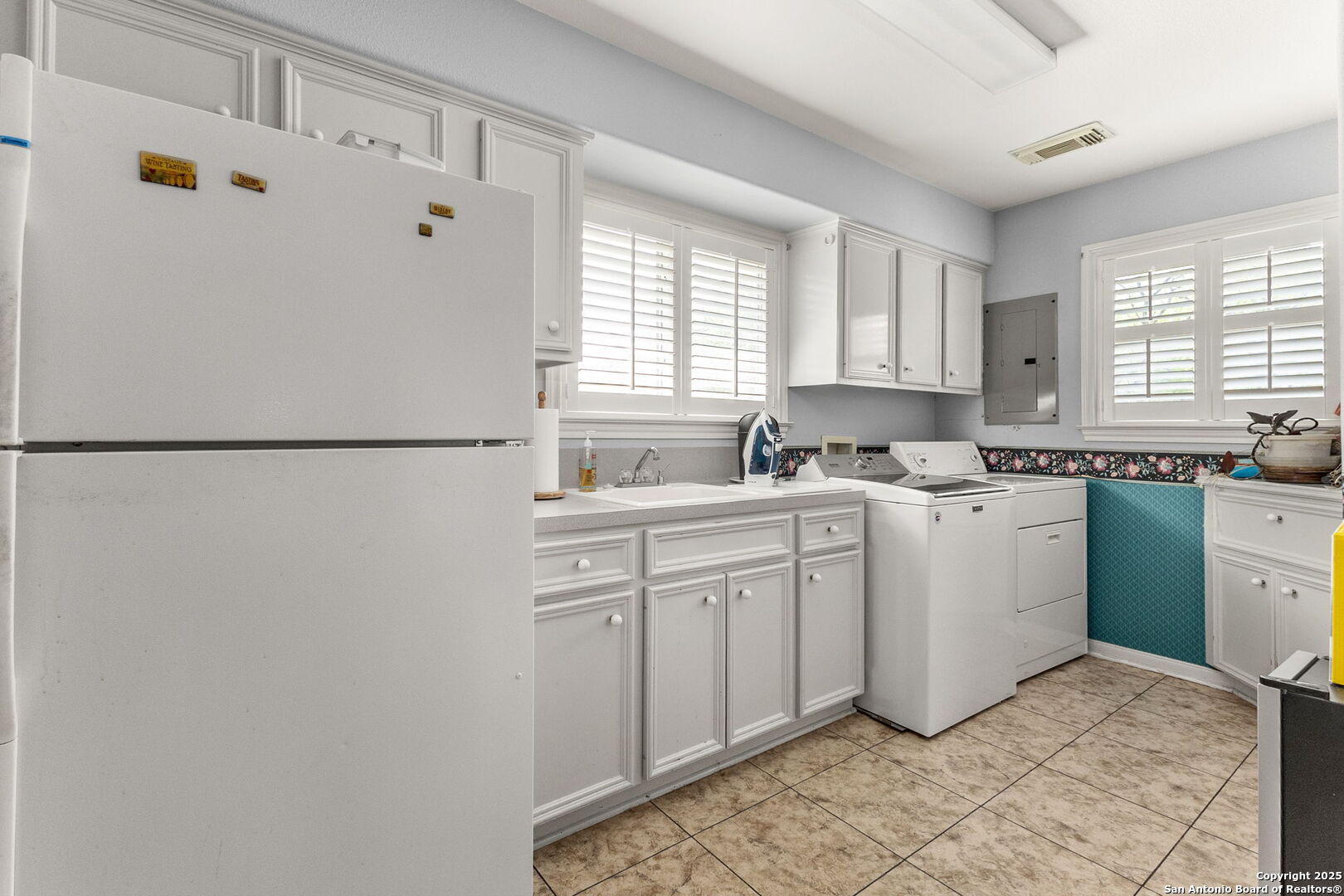 1434 Whispering Water Spring Branch, TX 78070 - Photo 26 of 45 a kitchen with a white cabinets and white appliances