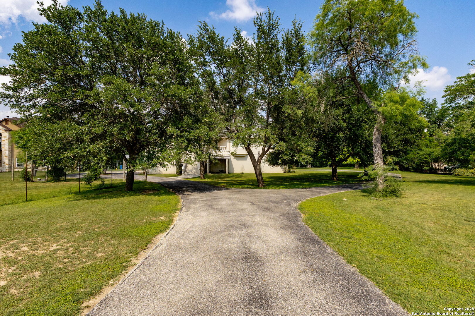 1434 Whispering Water Spring Branch, TX 78070 - Photo 5 of 45 a view of a swimming pool with a bench and trees around