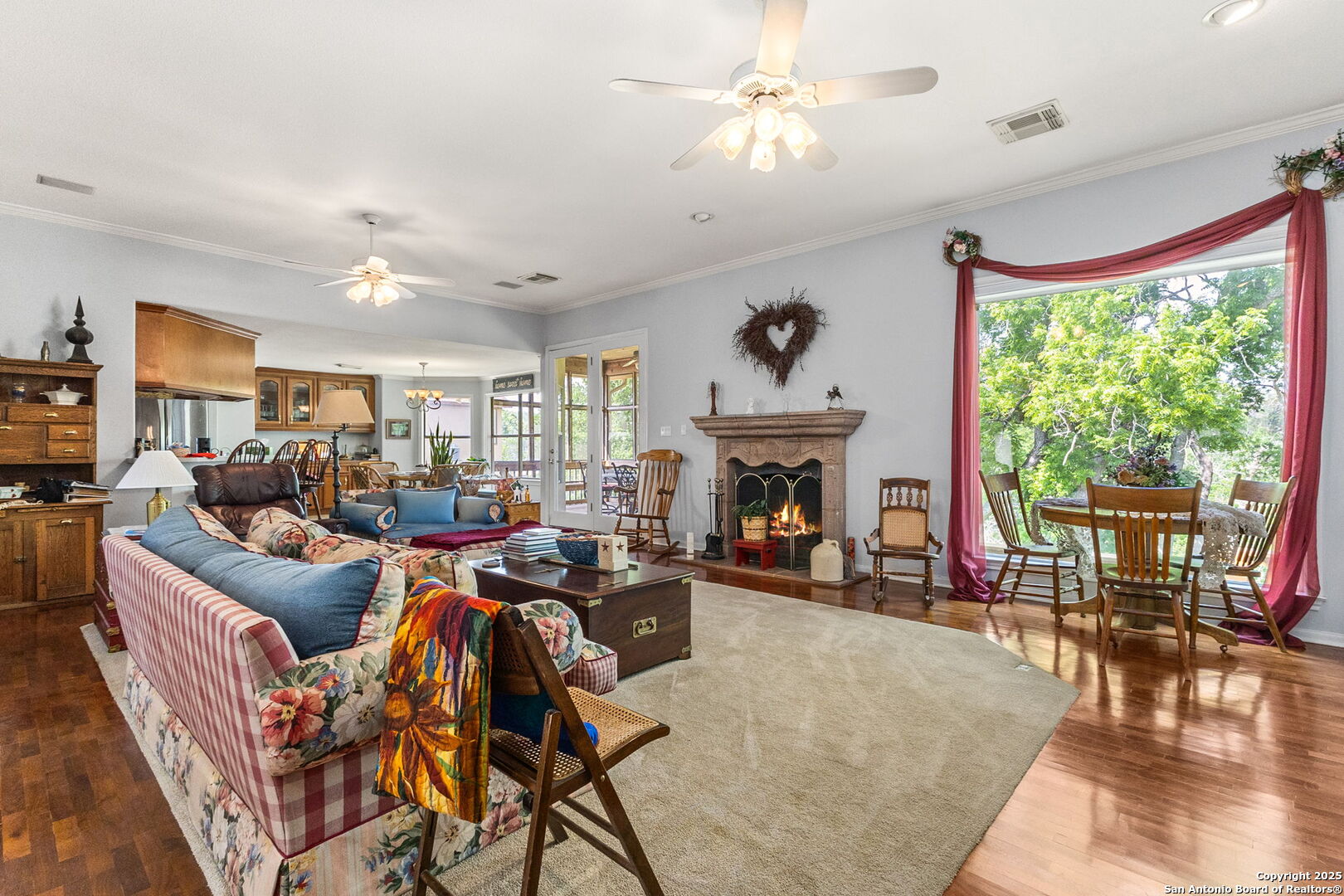 1434 Whispering Water Spring Branch, TX 78070 - Photo 7 of 45 a living room with furniture a fireplace and a large window