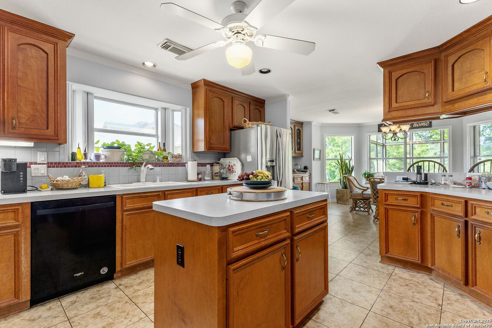 1434 Whispering Water Spring Branch, TX 78070 - Photo 8 of 45 a kitchen with stainless steel appliances granite countertop a sink a stove and a refrigerator