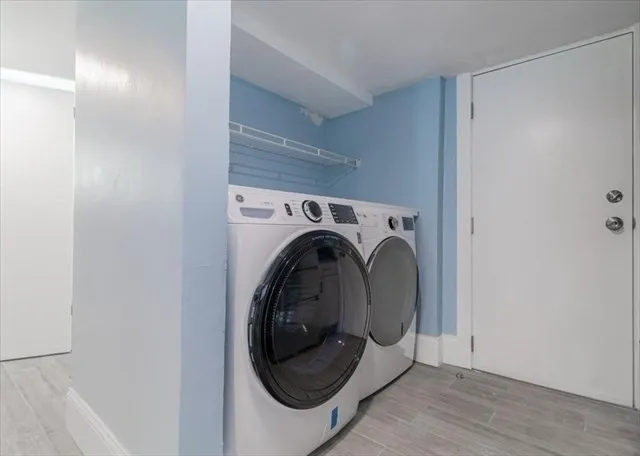 a utility room with dryer and washer