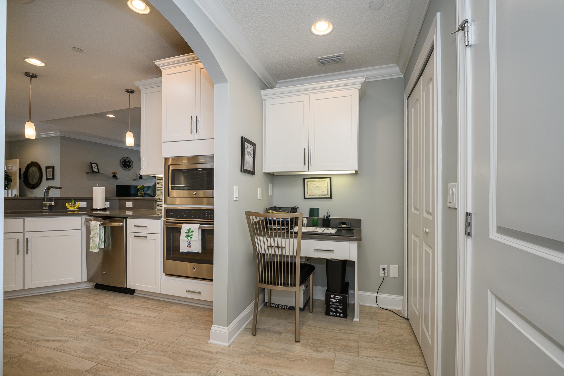 68 Ocale Court St. Augustine, FL 32084 - Photo 13 of 67 a kitchen with white cabinets and stainless steel appliances