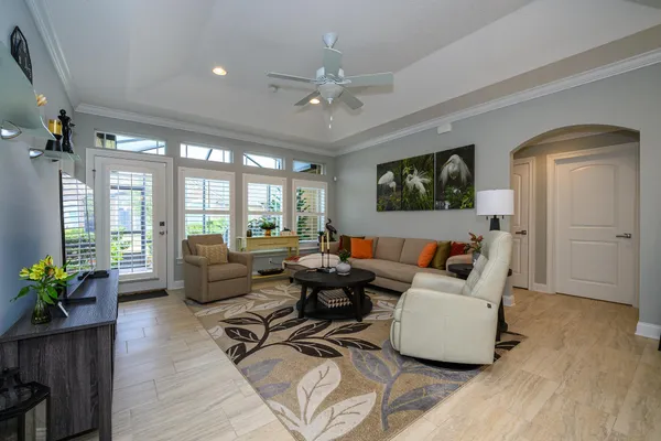 a living room with furniture window and a table
