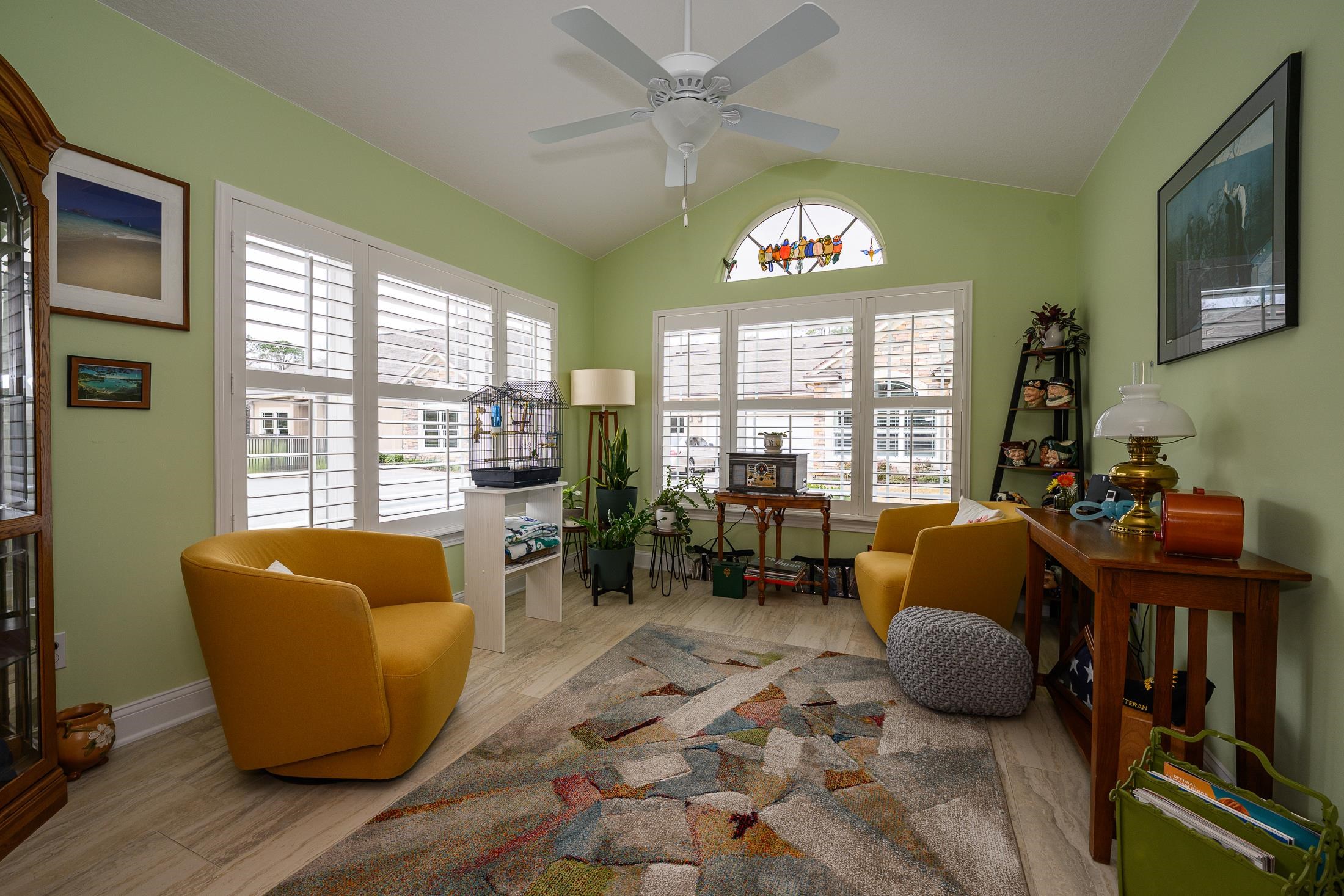 68 Ocale Court St. Augustine, FL 32084 - Photo 24 of 67 a living room with furniture floor to ceiling window and a flat screen tv