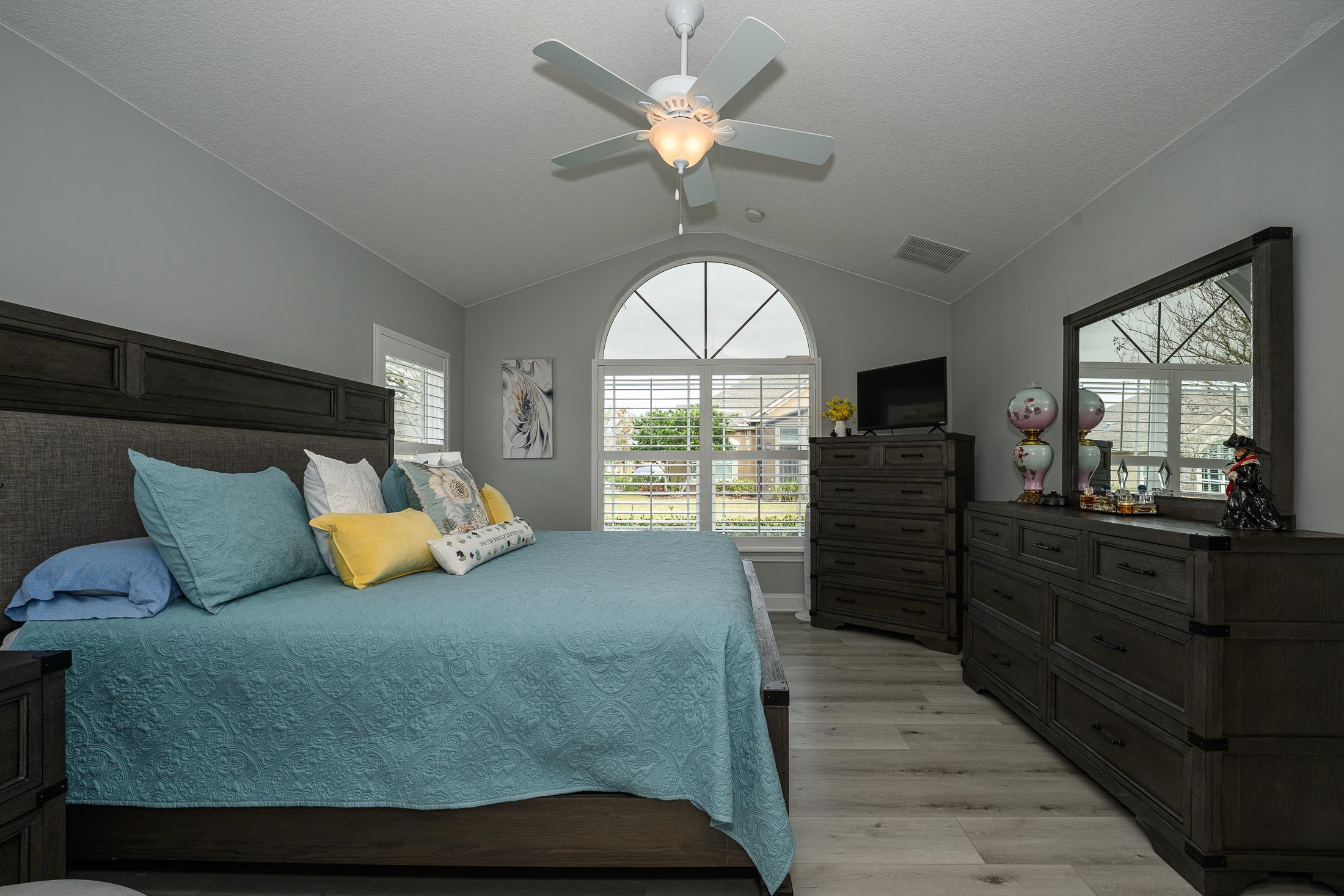 68 Ocale Court St. Augustine, FL 32084 - Photo 27 of 67 a bedroom with a large bed and a large window