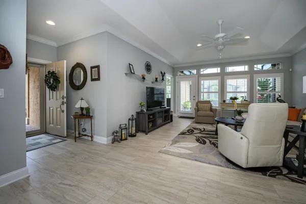 a living room with furniture and a flat screen tv
