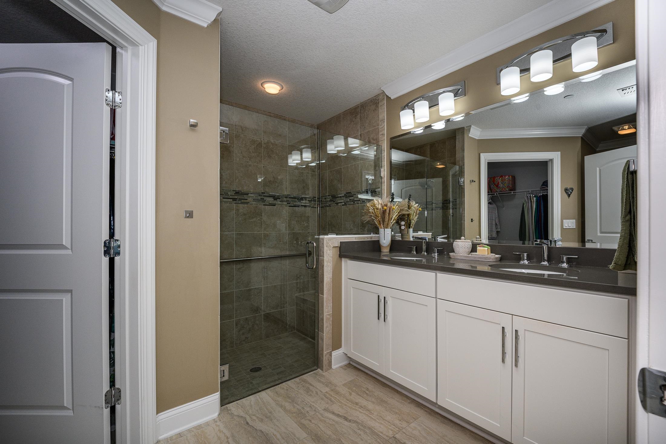68 Ocale Court St. Augustine, FL 32084 - Photo 32 of 67 a bathroom with a double vanity sink and a mirror