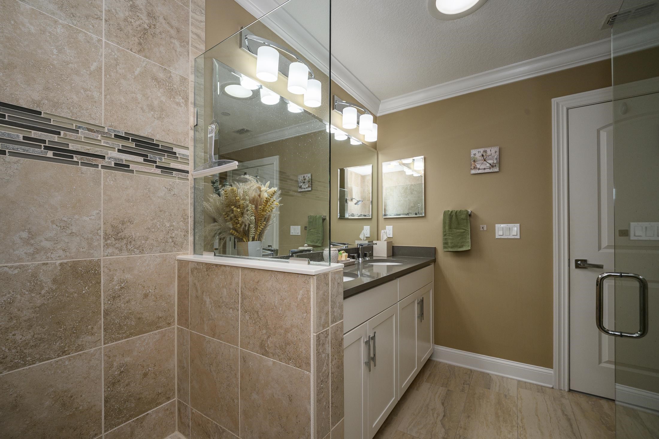 68 Ocale Court St. Augustine, FL 32084 - Photo 33 of 67 a bathroom with a granite countertop sink a mirror and a shower