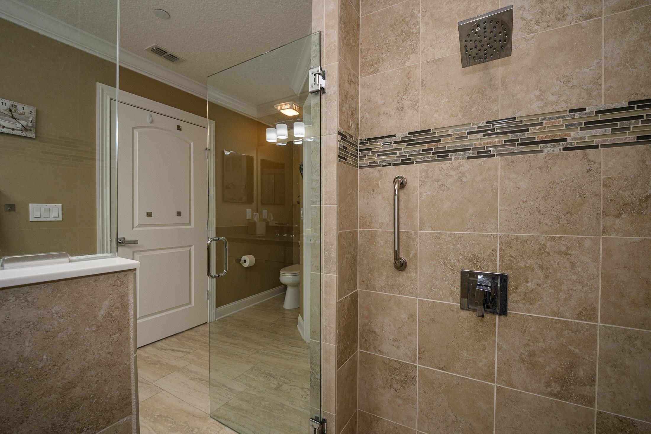 68 Ocale Court St. Augustine, FL 32084 - Photo 34 of 67 a bathroom with a granite countertop sink a toilet and shower