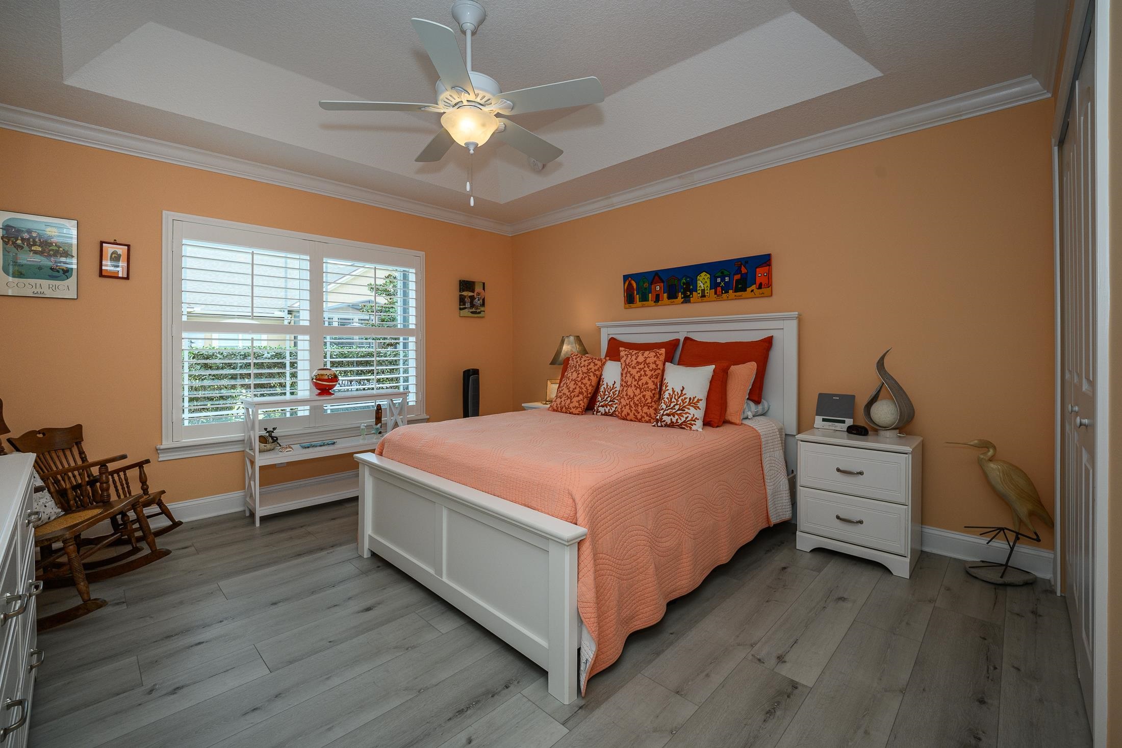 68 Ocale Court St. Augustine, FL 32084 - Photo 40 of 67 a bedroom with a large bed and a chandelier