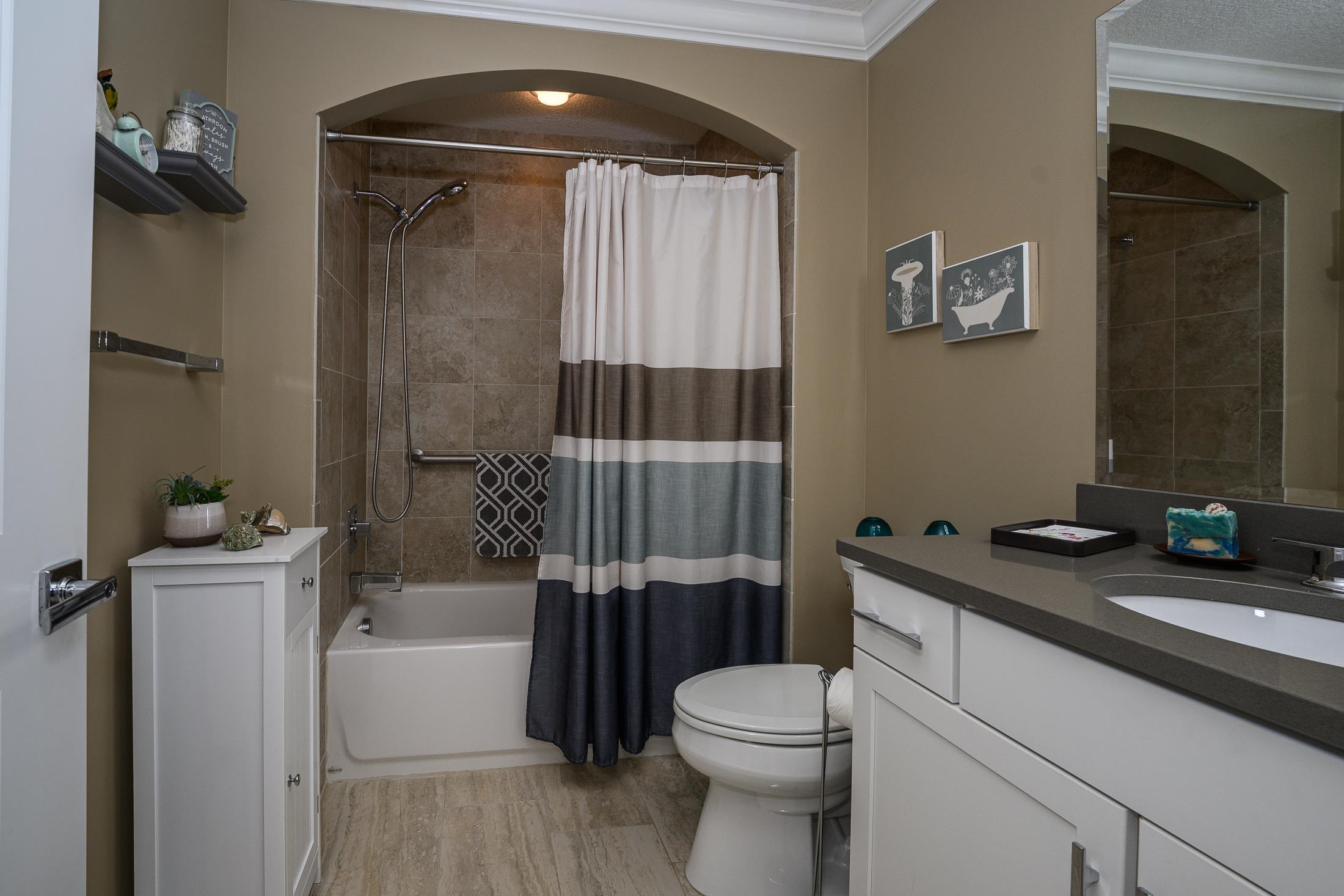 68 Ocale Court St. Augustine, FL 32084 - Photo 47 of 67 a bathroom with a granite countertop bathtub shower sink vanity and toilet