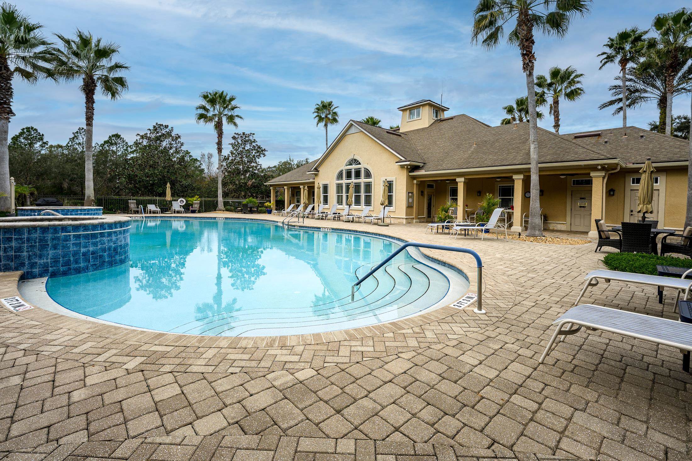 68 Ocale Court St. Augustine, FL 32084 - Photo 65 of 67 a view of a house with a swimming pool and sitting area