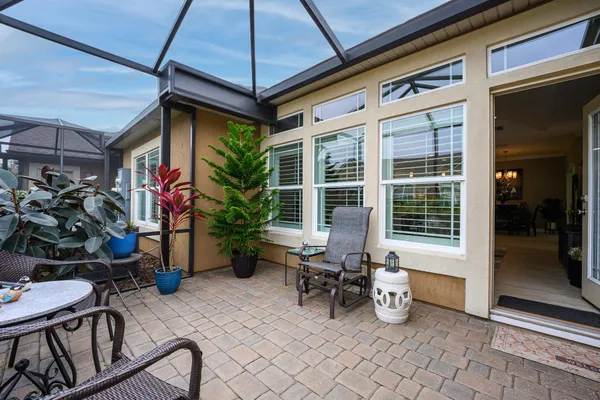 a view of a patio with chair and tables