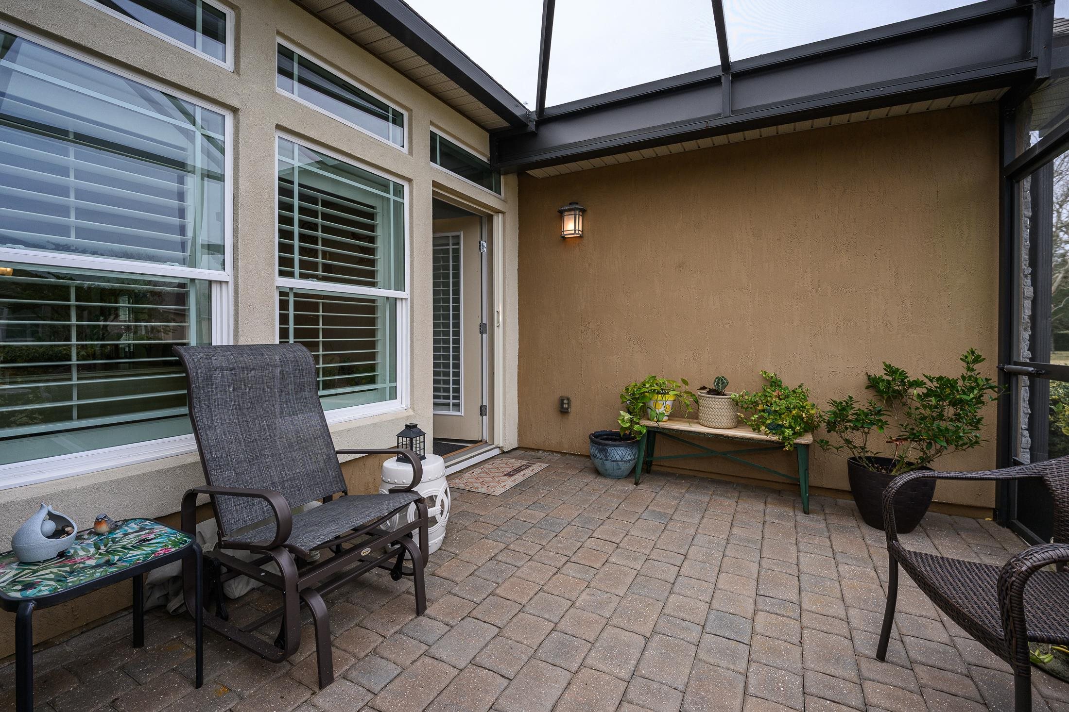 68 Ocale Court St. Augustine, FL 32084 - Photo 9 of 67 a view of a patio with chair and tables