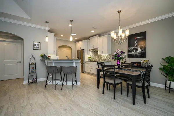 a large room with lots of counter space and windows